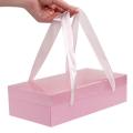 Коробка з ручками зі стрічки 27*13,5*7 см Рожева